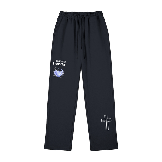 HYPE4HOLY CHRISTIAN APPAREL STREETWEAR RELAXED FIT SWEATPANTS BURNING HEARTS DESIGN FRONT DARK NAVY | pants with 'burning hearts' logo and cross design on a white background
